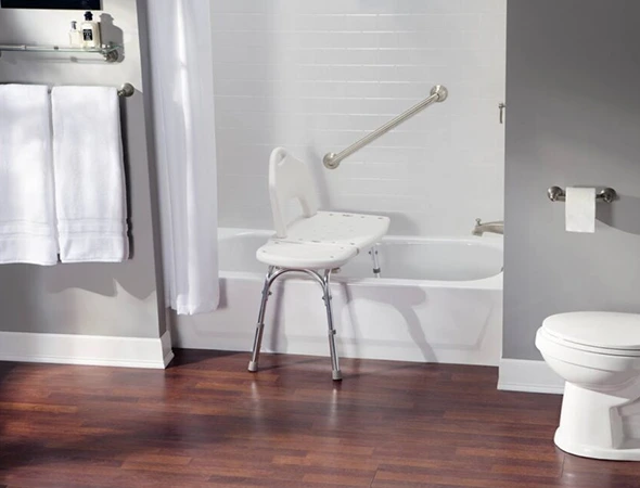Aging-in-place bathroom renovation with walk-in shower, grab bars, and non-slip flooring